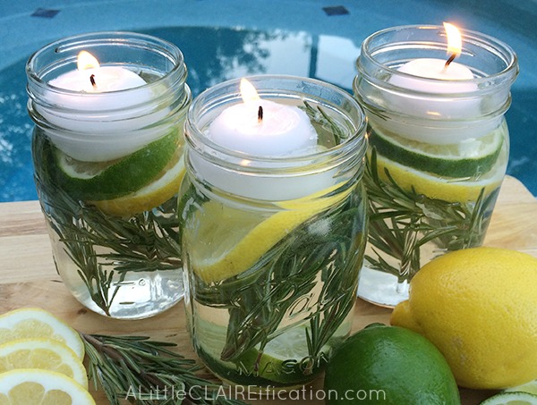 mason jars with mosquito repellant herbs and candles ready for the garden