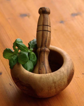 pestle and mortar with fresh herb