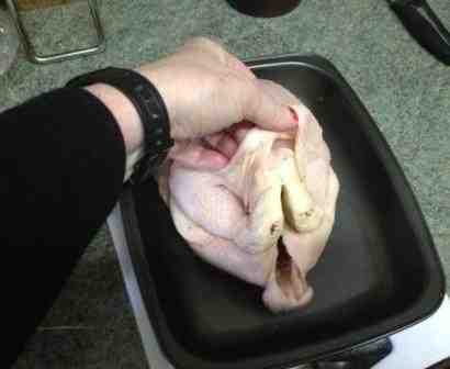 whole fresh chicken pulling skin away from flesh to put in the basil butter whole fresh chicken pulling skin away from flesh to put in the basil butter