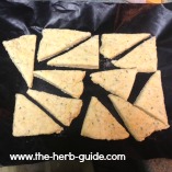 the cheese scones cut into triangles and laid on silicon