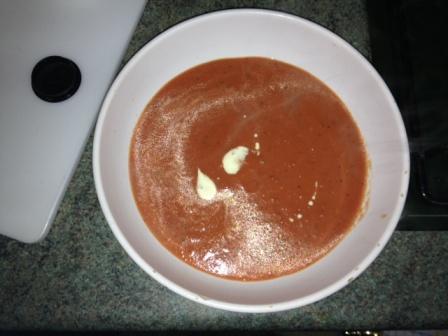 creamy tomato basil soup in a bowl with a swirl of cream on top creamy tomato basil soup in a bowl with a swirl of cream on top