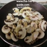 Sliced mushrooms added to garlic butter