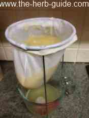 mixture straining through the jelly bag mixture straining through the jelly bag